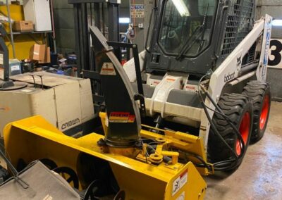 bobcat skid steer model 751 with snow blowing attachment